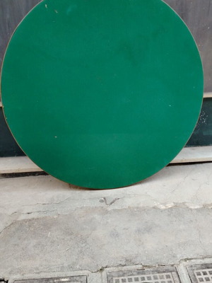 Round table used with green felt and folding beech legs