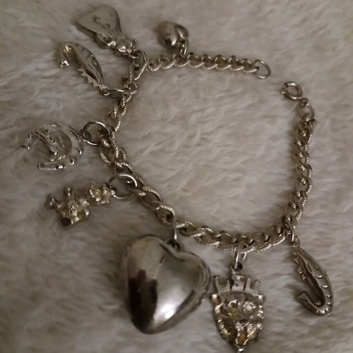Silver bracelet with charms like new