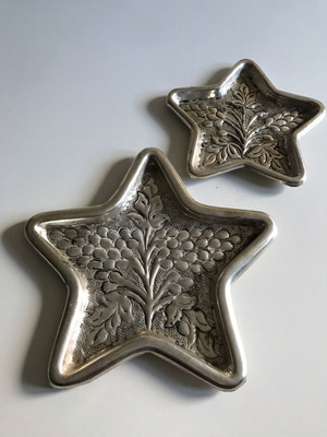 Silver star-shaped carved coasters set of 2 like new
