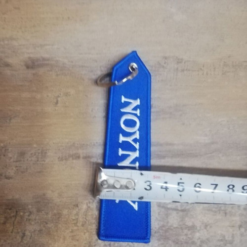 Nounou keychain new, blue with white letters