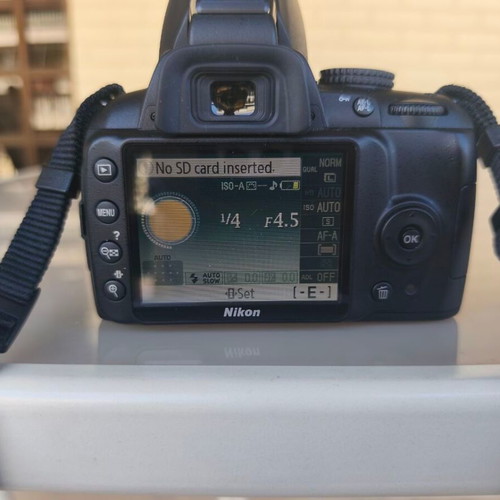 Nikon D3000 camera with AF-S 18-55mm f/3.5-5.6 lens and bag