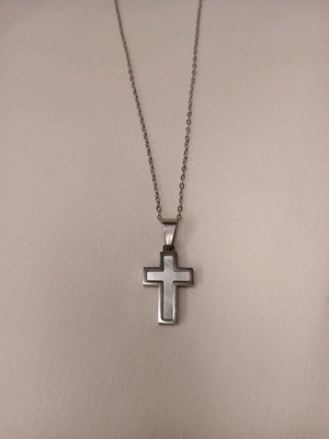 Steel cross in silver color like new