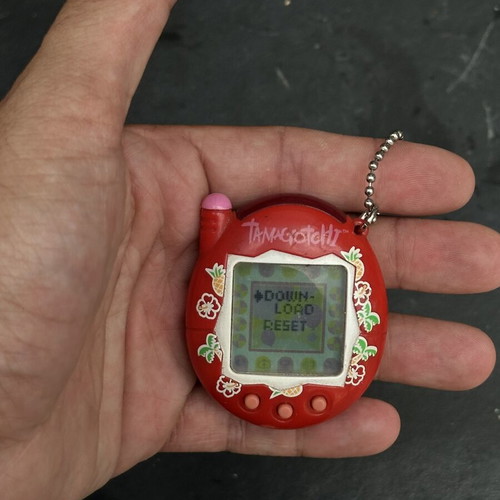 Vintage Tamagotchi Bandai 2004 red tropical design electronic keychain used