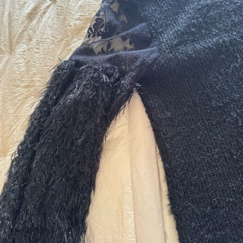 Knitted blouse like new with metallic thread and lace sleeves black