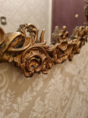 Rococo style wall mirror with gold embossed frame