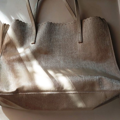 Women's shoulder bag metallic silver with flower cutouts