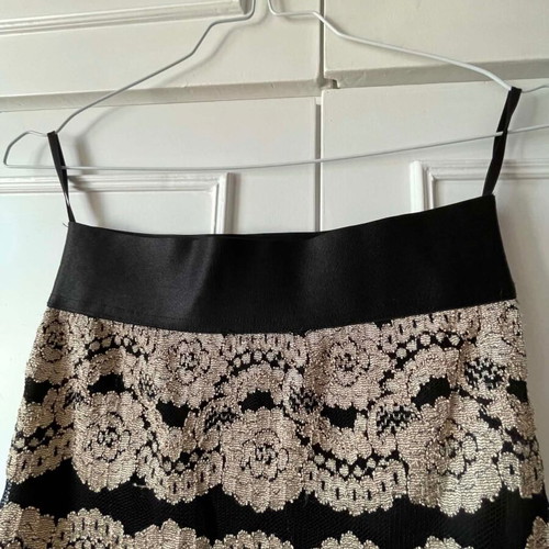Skirt black with gold embroidered flowers, like new, knee-length