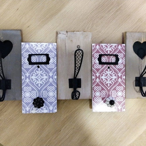 Decorative wall hanger used with wooden base and metal hooks