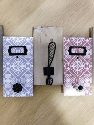 Decorative wall hanger used with wooden base and metal hooks