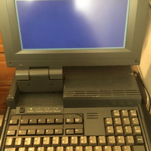 Sharp PC-4500 laptop collectible with charger