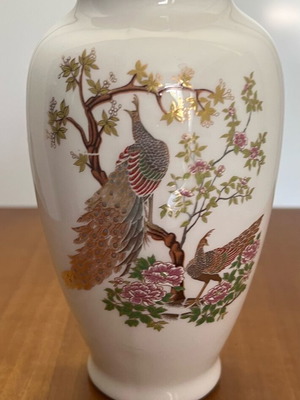 Vintage porcelain vase with peacock and floral designs used