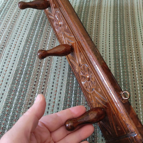 Vintage carved wooden coat rack with three hooks