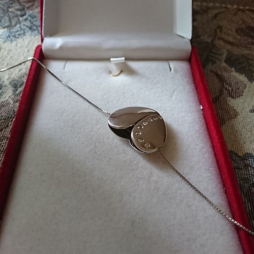 Silver heart-shaped pendant like new