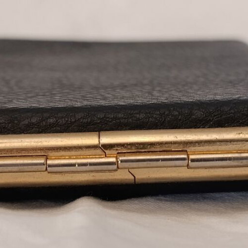Classic cigarette case used, black leatherette with bronze interior