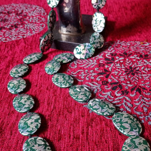 Acrylic green necklace used with holographic silver floral details