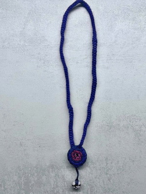Handmade knitted necklace with decorative details, purple