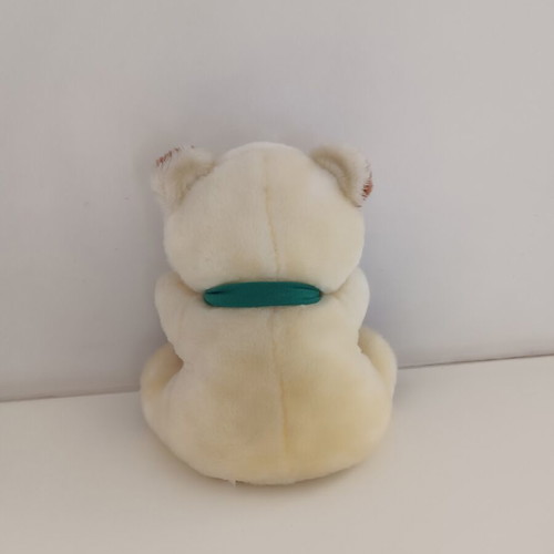 Plush teddy bear with green scarf, ecru