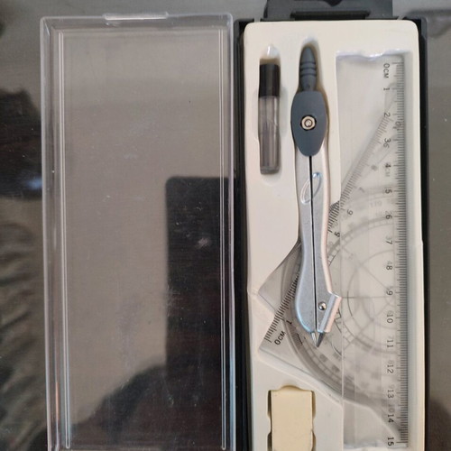 Geometry set like new with compass, protractor, ruler, and pencil