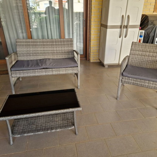 Garden sofa set with cushions and table