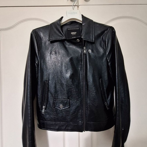 Only black biker jacket made of faux leather with silver details used