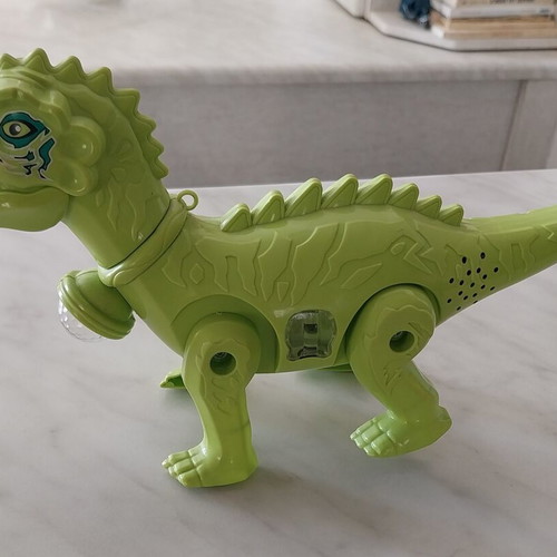 Dinosaur toy like new, walks, lights, and makes sounds, 28cm