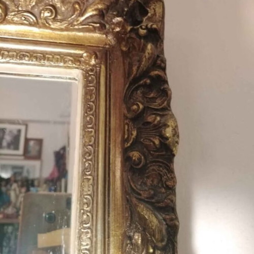 Antique mirror used with carved frame in gold crackle finish