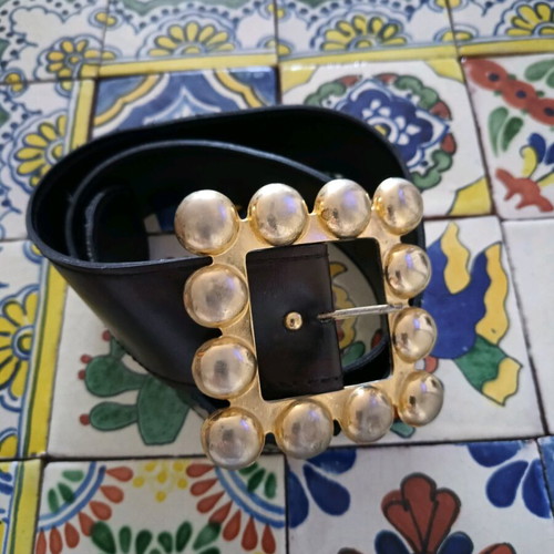 Belt used from faux leather with impressive brown buckle