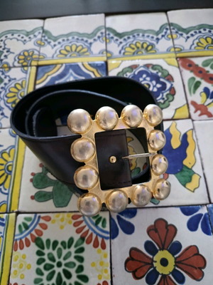 Belt used from faux leather with impressive brown buckle