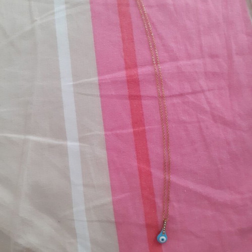 Steel necklace new with eye and decorative blue stones