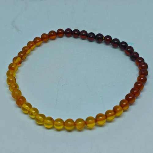 Handmade bracelet from natural amber with color gradient like new