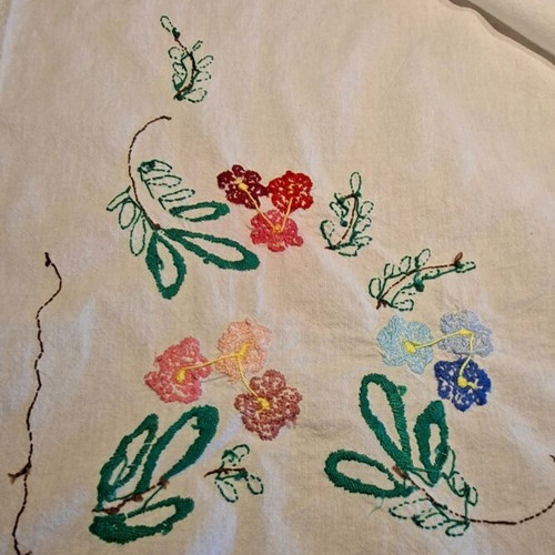 Vintage handmade embroidered tablecloth with flowers and needlework