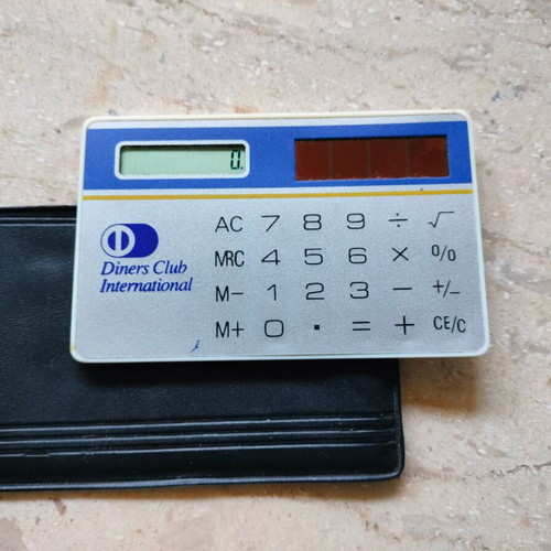 Diners credit card calculator used with solar power and case