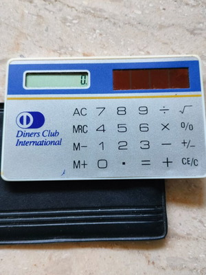 Diners credit card calculator used with solar power and case