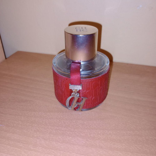 Empty Hugo Boss and Carolina Herrera perfume bottles collectible