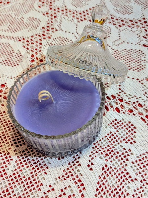 Scented candle in glass fondue pot, lavender aroma