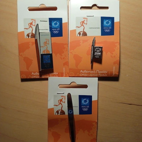 3 collectible pins with torches themed around the Athens 2004 Torch Relay