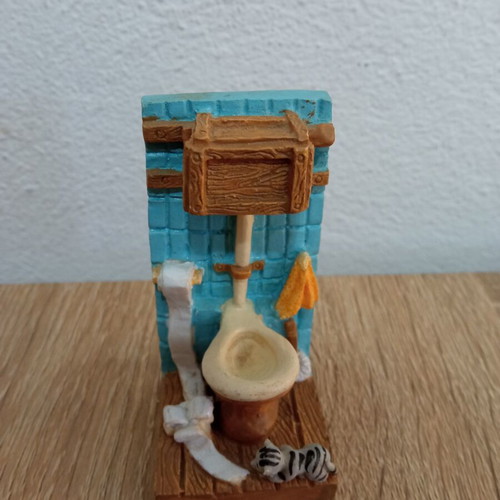 Toilet decoration with cat figurine used