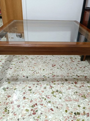 Solid wood coffee table with glass top like new