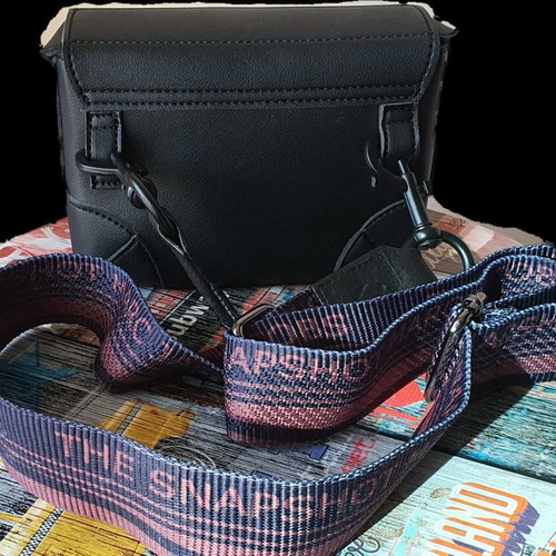 Shoulder bag like new with Rock'n' Roll prints, black and blue