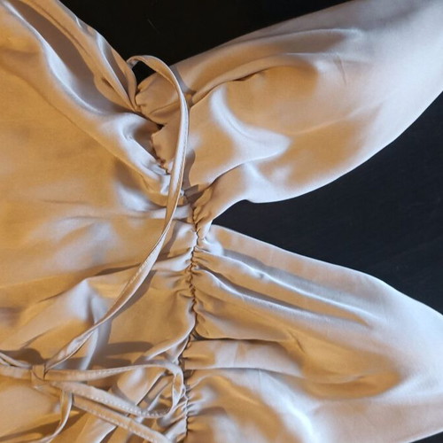One-piece mini romper like new, gold with crisscross back