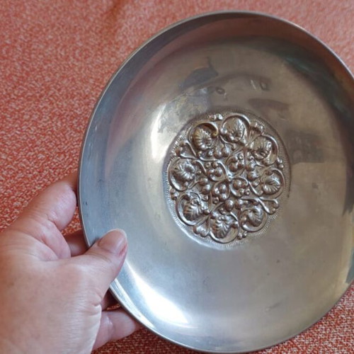 Silver-plated centerpiece bowl used with carved details and three feet