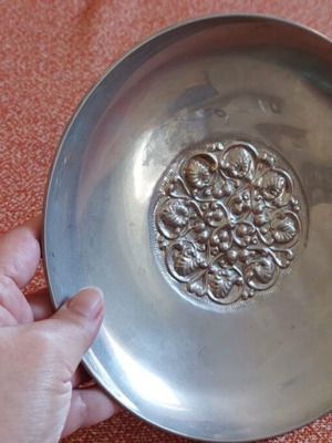 Silver-plated centerpiece bowl used with carved details and three feet
