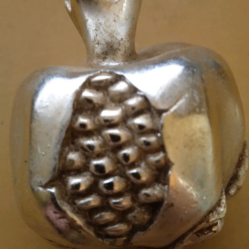 Embossed metal decorative pomegranate vintage used