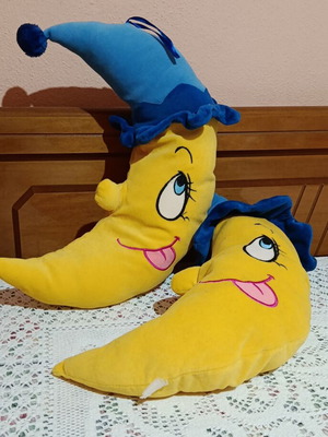 Set of 2 plush moon pillows used for kids' room decor