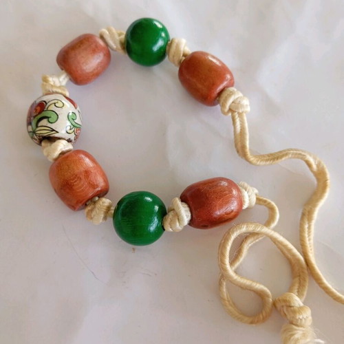 Handmade bracelet with cord and wooden beads green and brown