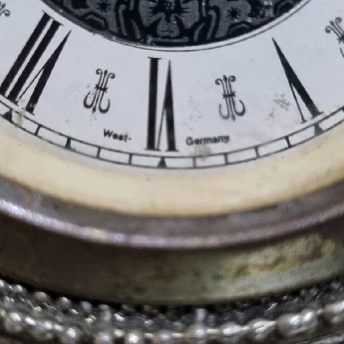 Antique clock used with German mechanism and porcelain decoration