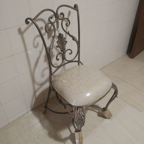 Set of 2 wrought iron dining chairs with decorative leaf details