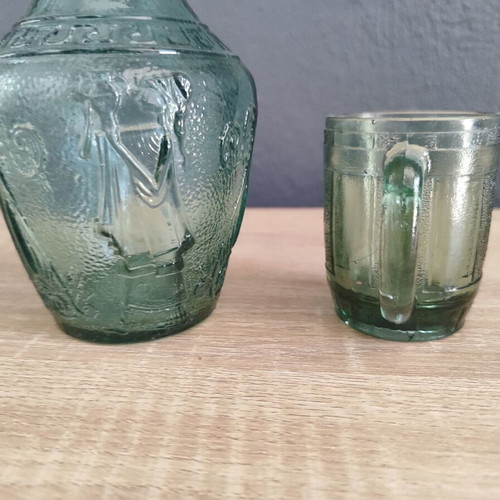 Vintage glass carafe with wine glass used