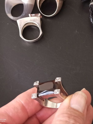 Silver ring with dark brown stone used