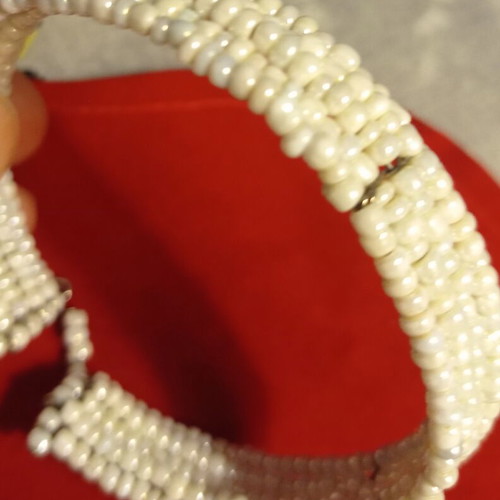 Vintage bracelet used with multiple rows of tiny white beads